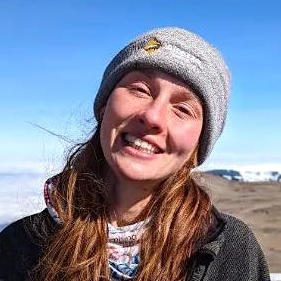 Abi outdoors with a smile