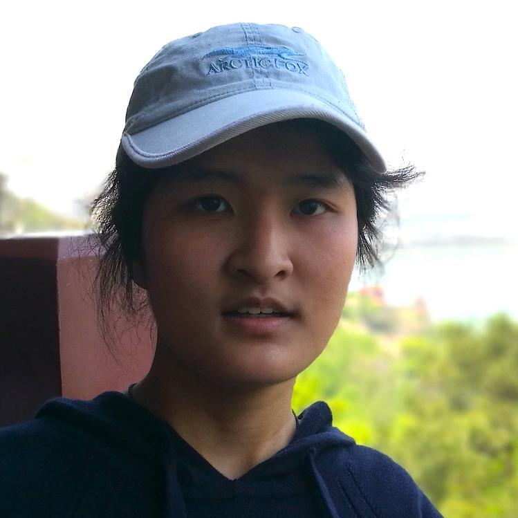 Jiayu outdoors with a hat