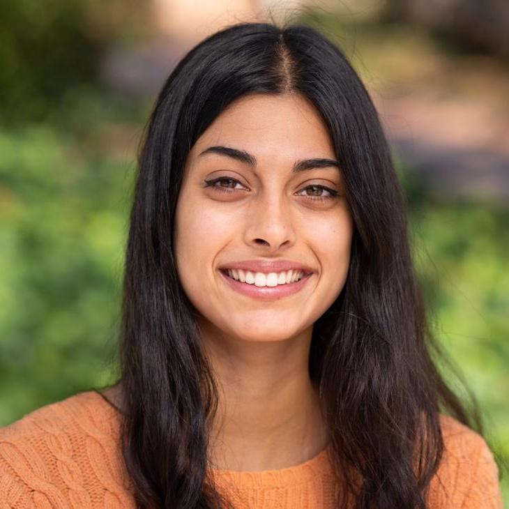 Shloka outdoors with a smile