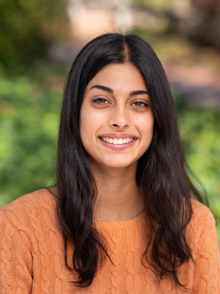 Shloka outdoors with a smile