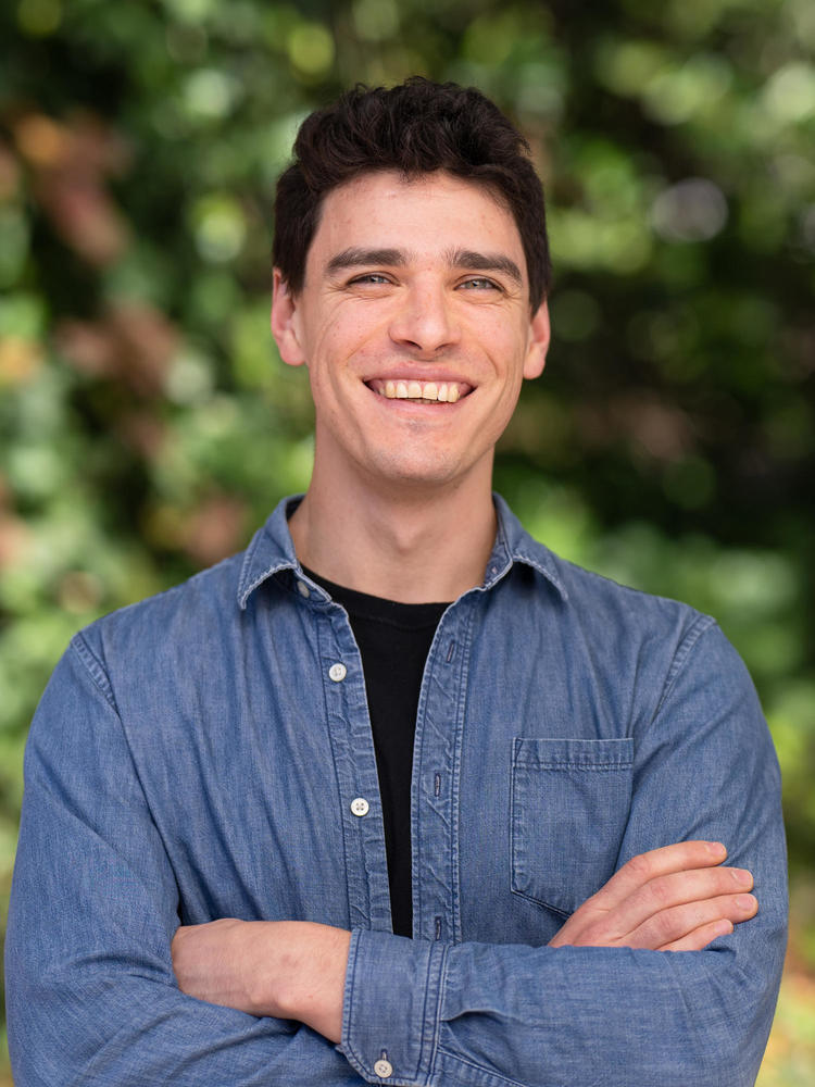Jacob outdoors with a smile
